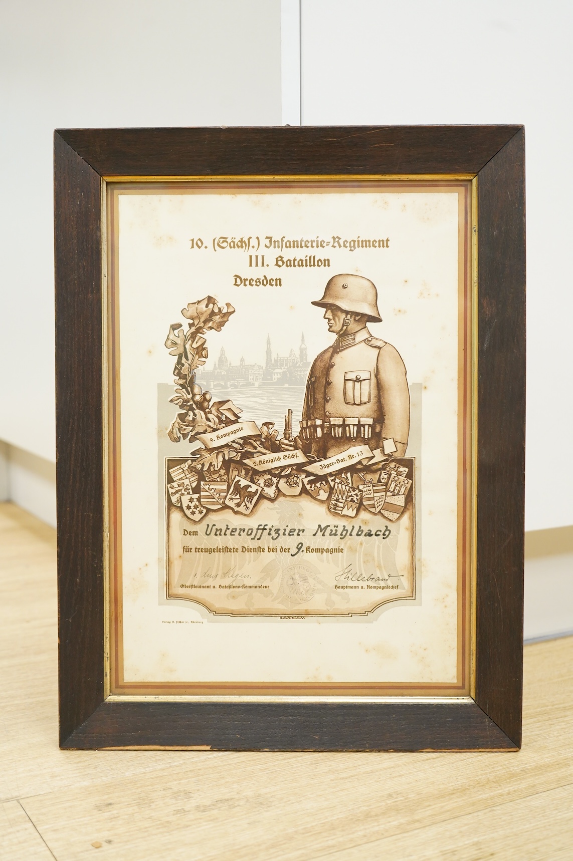 A framed WWI German Service Certificate awarded to Unteroffizier Mullback, 51.5x38.5cm including the frame